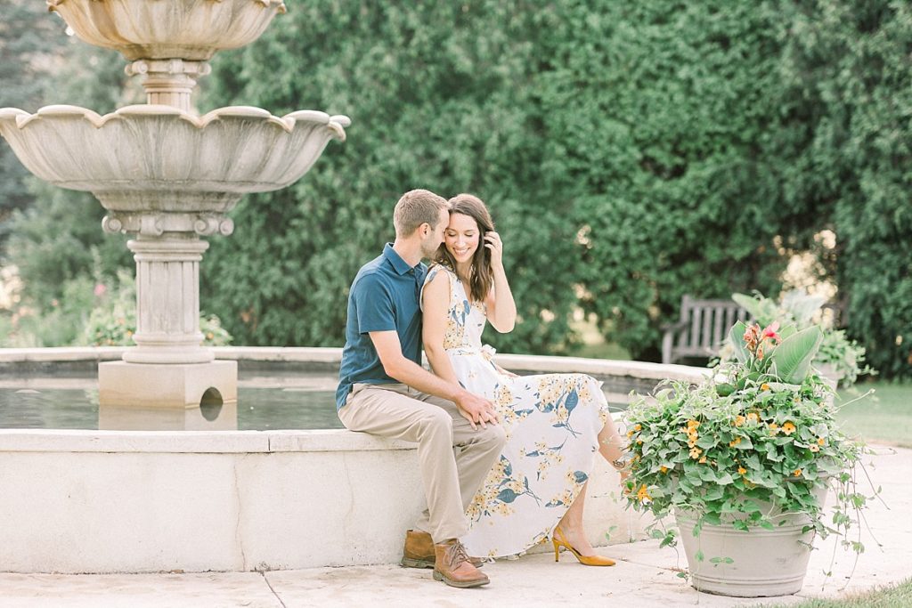 Sunrise engagement photos by fountain
