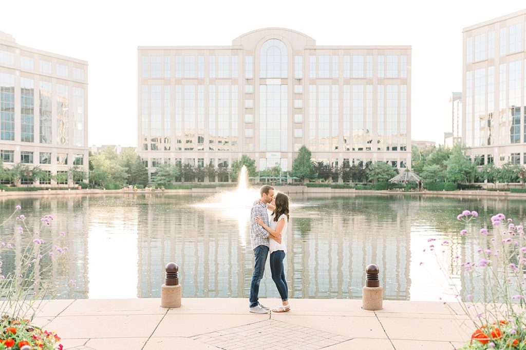Couple kissing in front of fountain