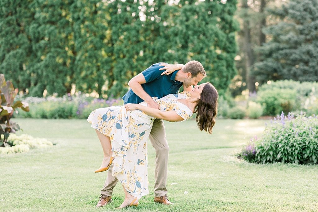 Groom dips bride for engagement photos