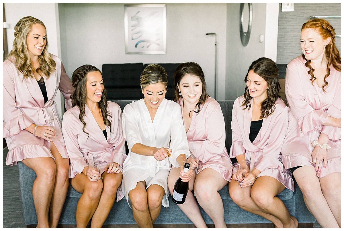 Bridesmaids have champagne before wedding
