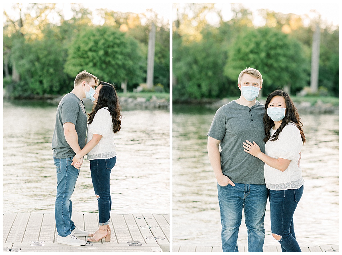couple kissing in masks for engagement session