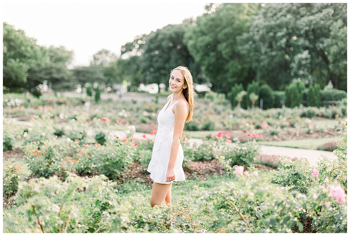 girl posing in field of flowers