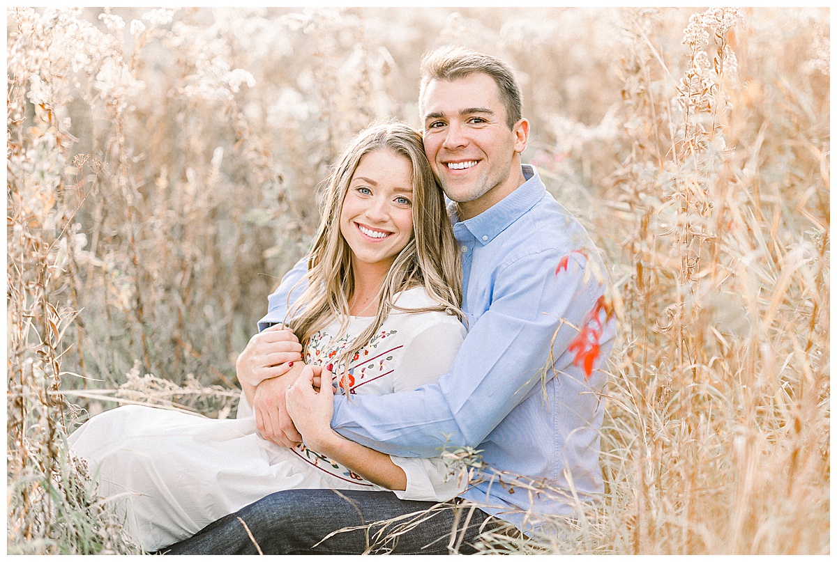 couple in field for engagement photos