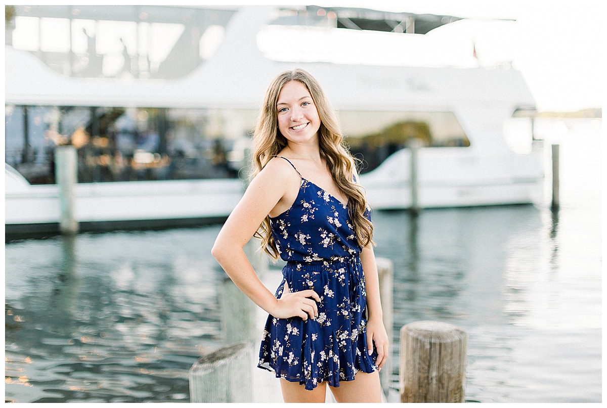 Girl posing by boat in Excelsior