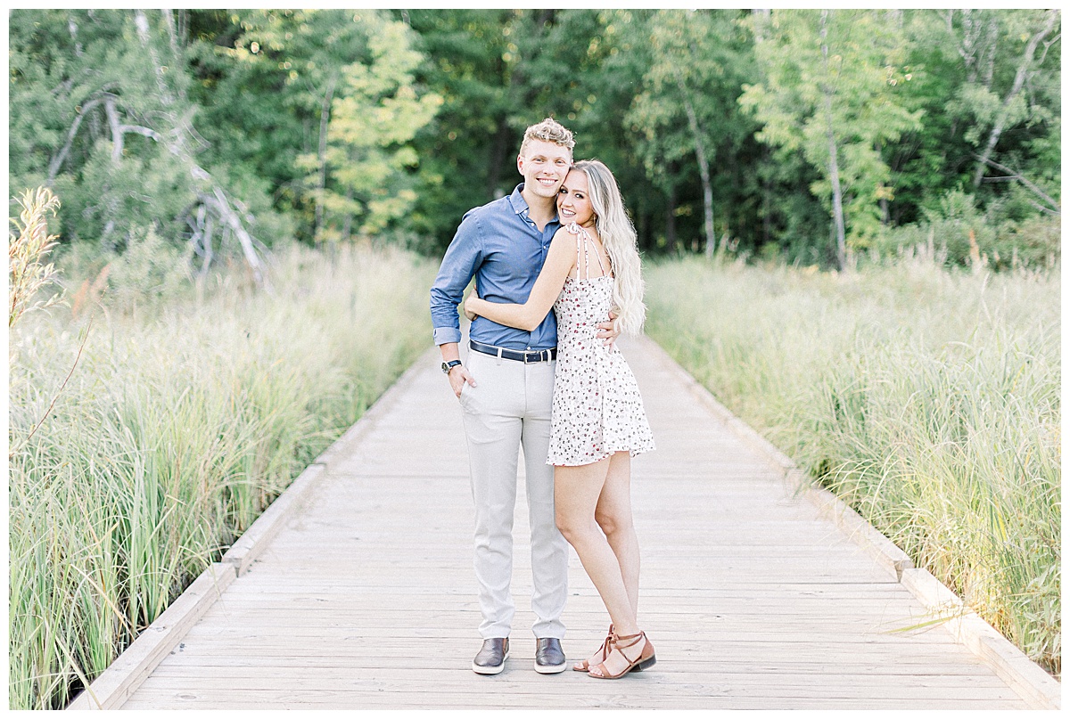 couple hugging on pathway for engagement photos