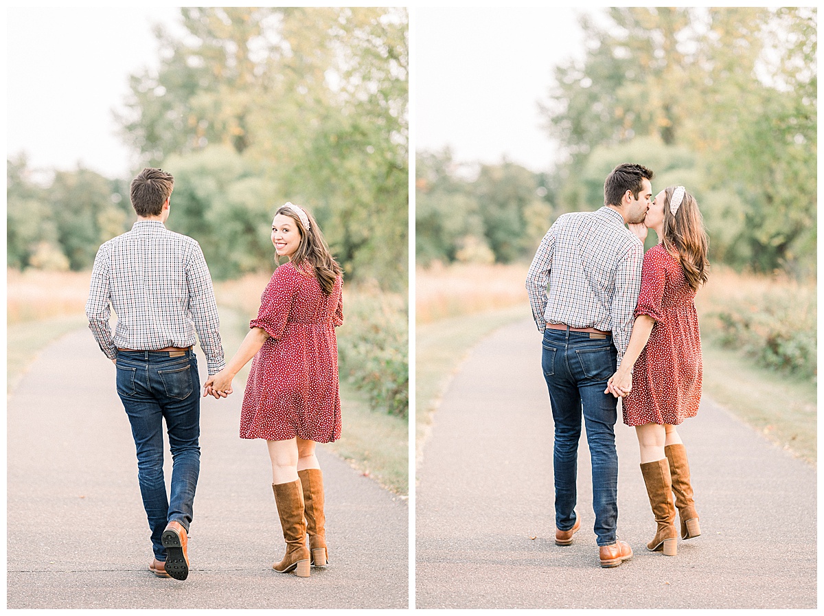 couple walking on pathway for maternity session