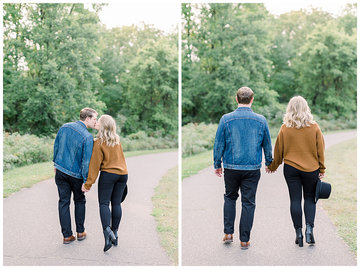 couple walking down pathway for engagement photos