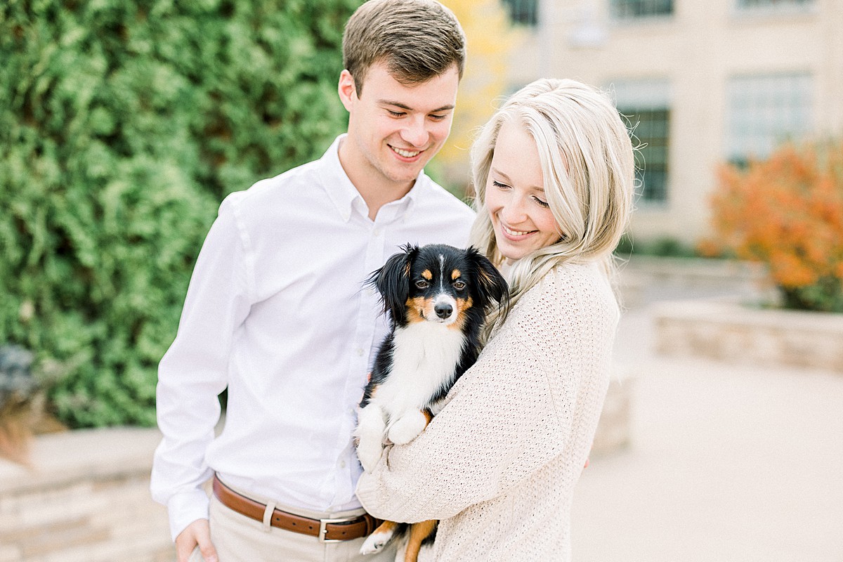 Engaged couple with dog at Mill Ruins Park